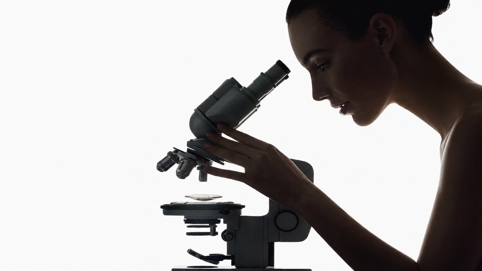 Longevia Research — Silhouette of a researcher examining a high-purity laboratory sample
